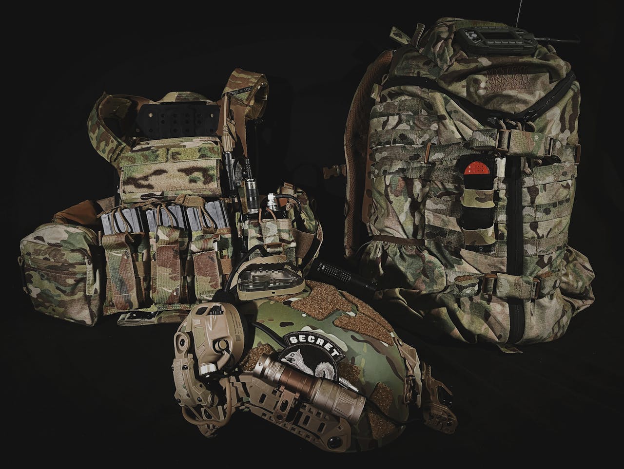 why-choose-us-02 Comprehensive display of equipped tactical military gear, ready for operations.